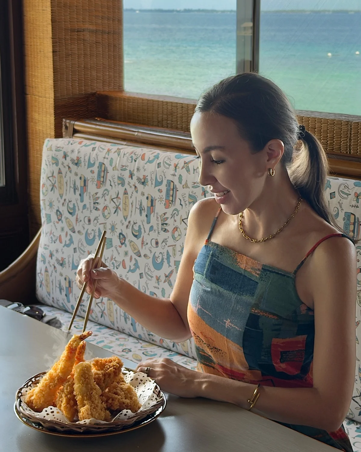 Guest enjoying mixed tempura at a Plantation Bay restaurant