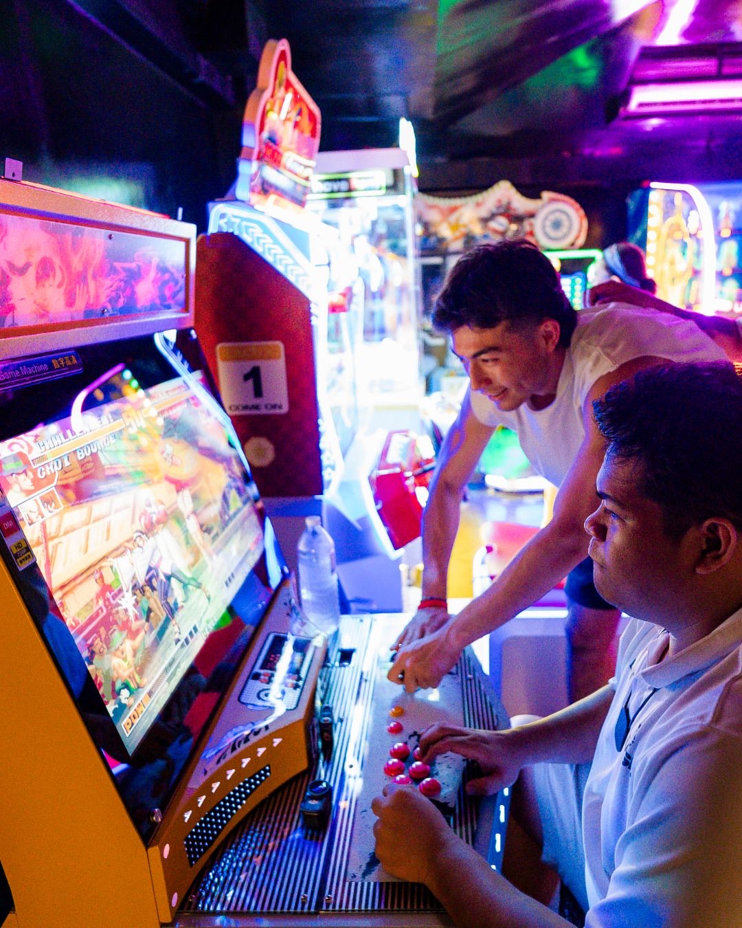 Two guests at the arcade fighting game