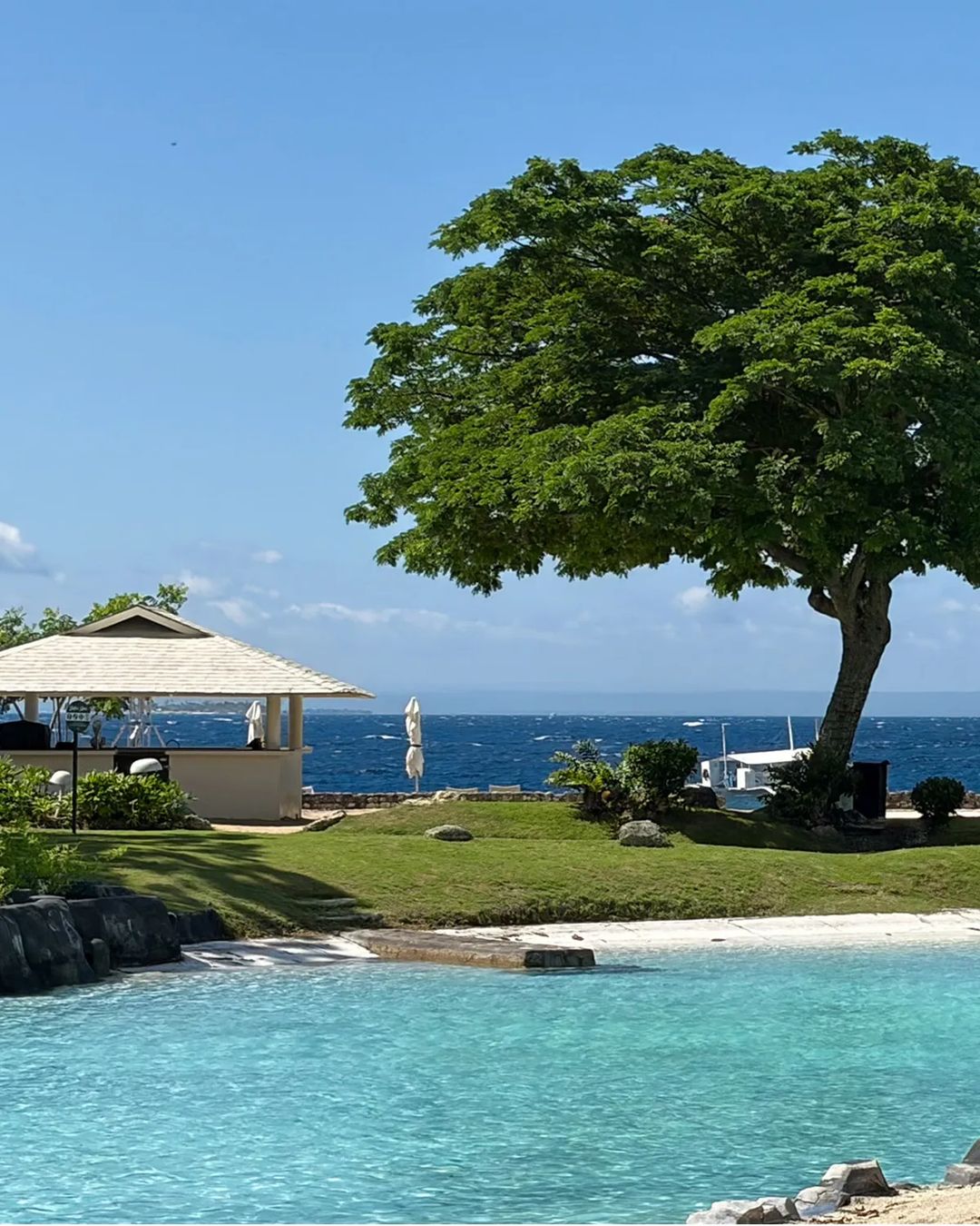 Lagoon, acacia foliage, and the open sea beyond