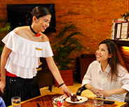 Server attending to guests at Palermo restaurant