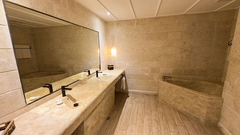 Beachside One-Bedroom Suite bathroom with double-sink vanity and corner soaking tub
