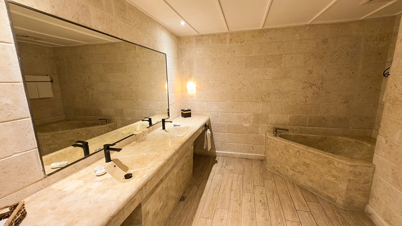 Beachside Two-Bedroom Suite bathroom with double-sink vanity and corner soaking tub