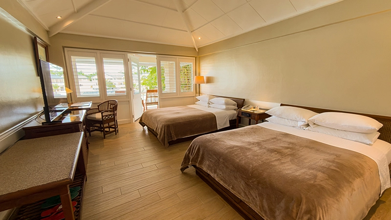 Beachside Two-Bedroom Suite second bedroom with two queen beds and balcony doors