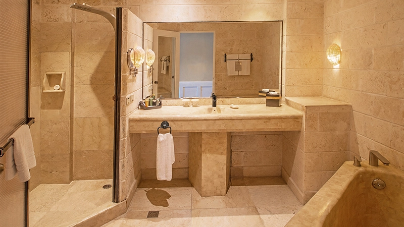 Ground-Floor Beachside Room marble bathroom with walk-in shower and soaking tub