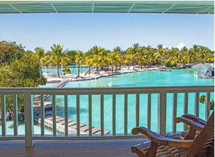 Veranda chairs overlooking the saltwater lagoon at Plantation Bay